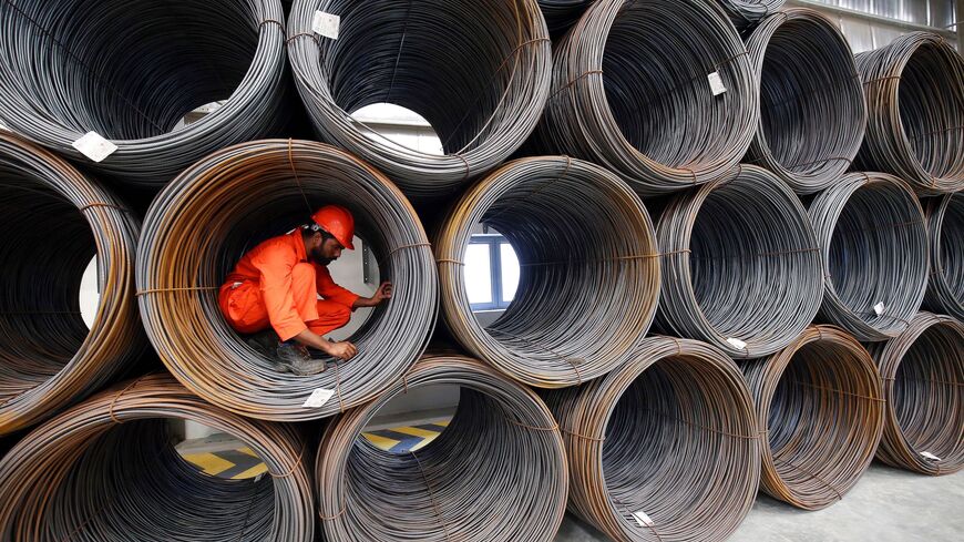 A worker is seen at the Kuwait Global Steel Services factory in Kuwait City on December 5, 2018. (Photo by Yasser Al-Zayyat / AFP) (Photo credit should read YASSER AL-ZAYYAT/AFP via Getty Images)