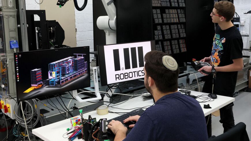 Technicians work at the headquarters of the Israeli company 1MRobotics.