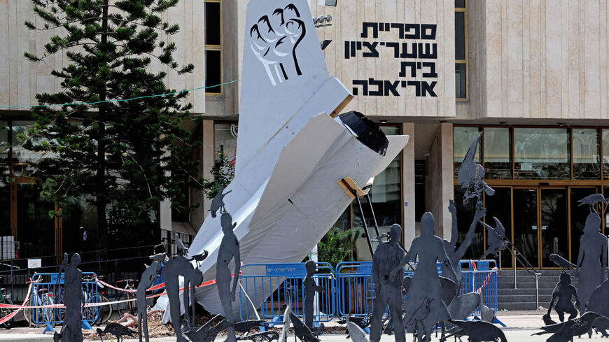 An installation of a crashed Israel Air Force fighter jet is displayed in a protest against the government's judicial reform bill, Tel Aviv, Israel, March 29, 2023.